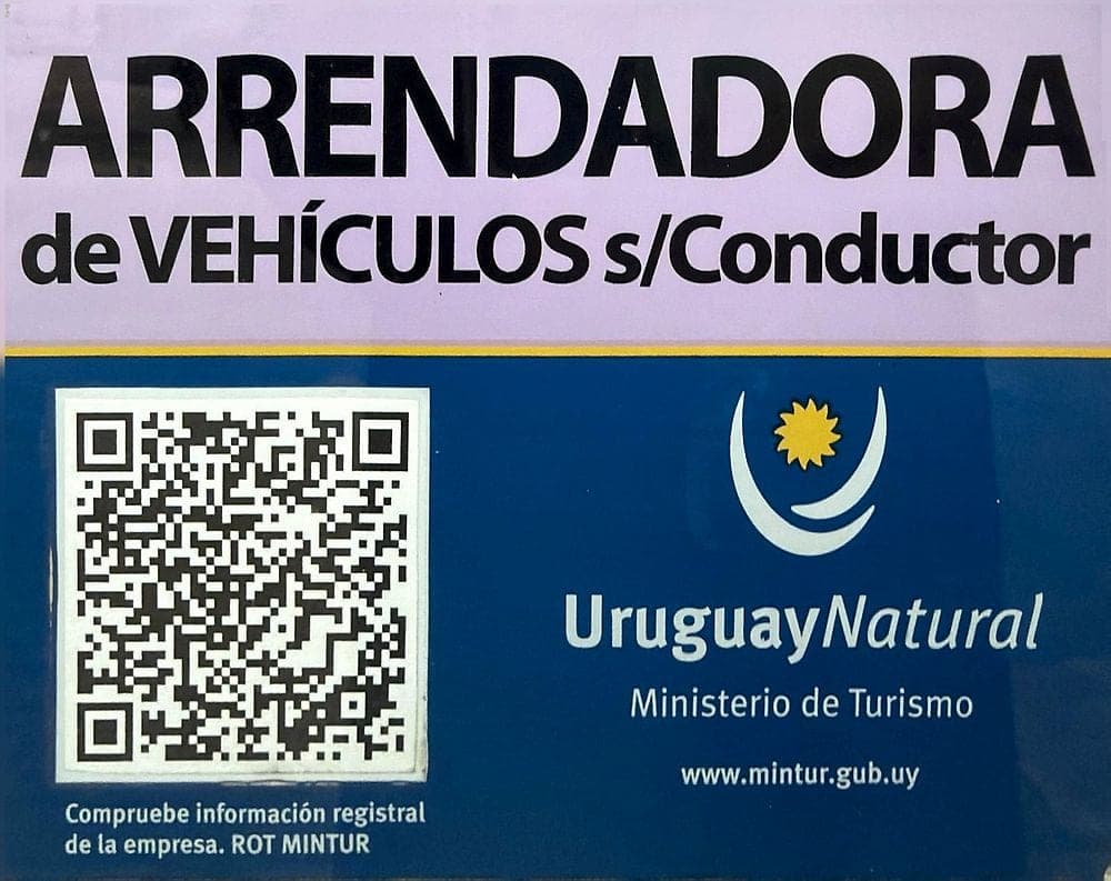 Official plaque certifying the company as a car rental company without a driver, with the logo of Uruguay's Ministry of Tourism (Ministerio de Turismo) and a QR code to verify the registry information